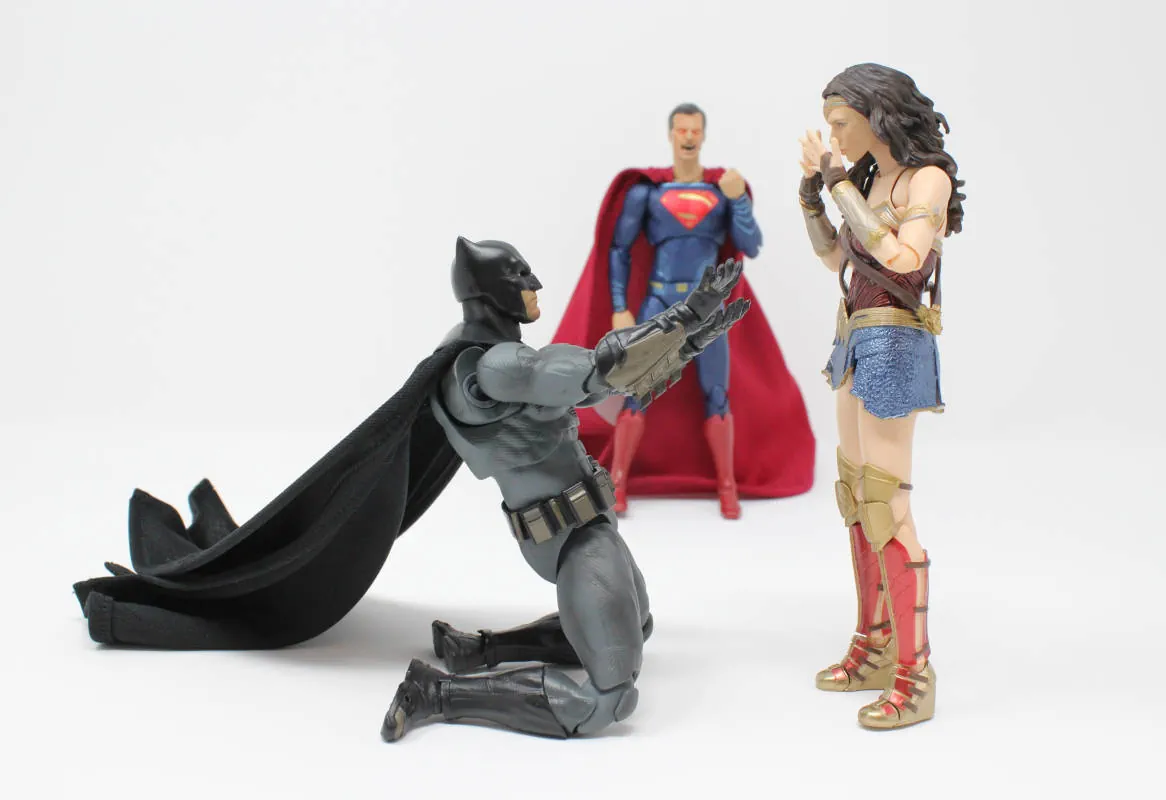 3 super hero figurines in a drama triangle