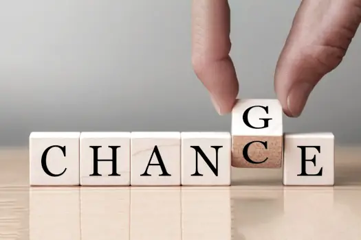 Career Transition Coach: Turning a Career Shift into an Opportunity, with 5 Wooden Blocks Spelling Out "Change" or "Chance"